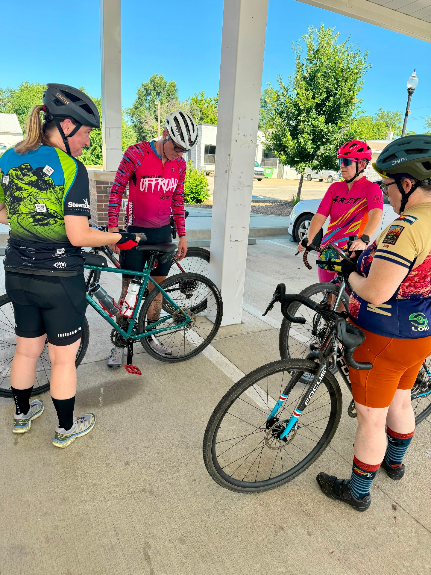 More Than Miles women gathered with their gravel bikes before a group ride.